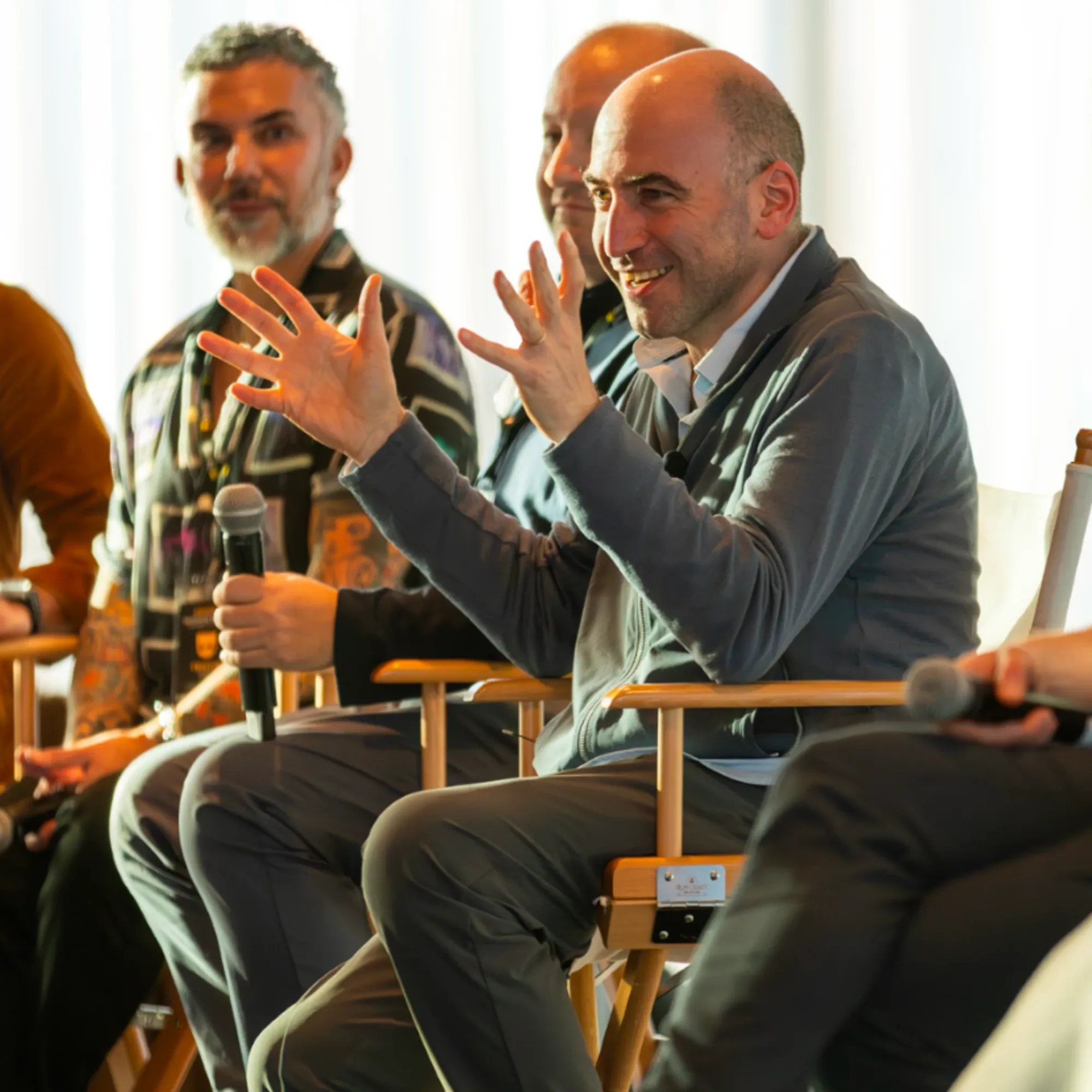 Grindr CEO George Arison gestures enthusiastically during panel