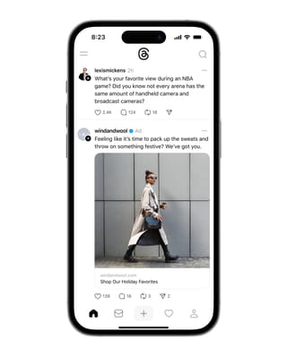 Threads mobile interface showing sponsored advertisement from Wind and Wool between organic posts