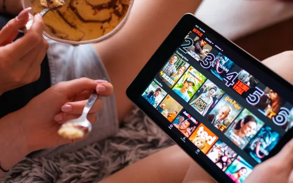 Netflix tablet streaming interface showing pricing strategy impact on European subscribers choosing ad-supported tiers.