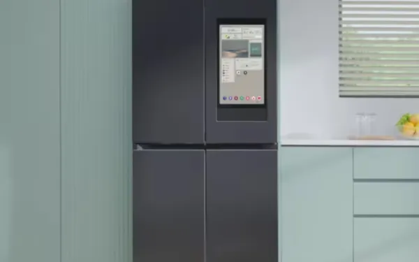 Samsung Family Hub smart fridge with 21.5-inch touchscreen displaying interface in modern kitchen setting.